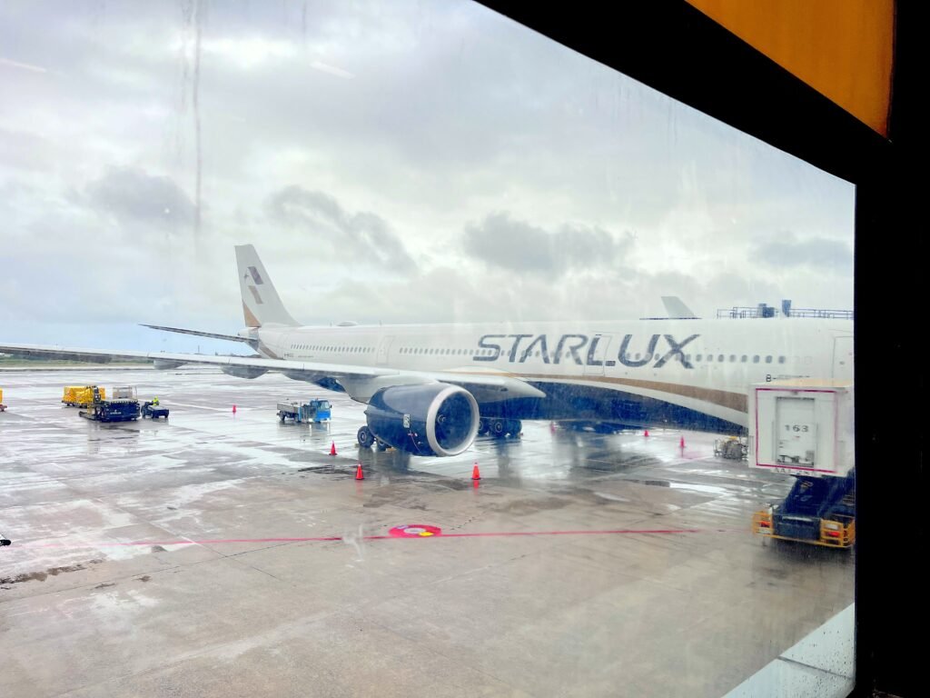 STARLUX Airlines aircraft preparing for boarding at Terminal 1 of Taiwan Taoyuan International Airport